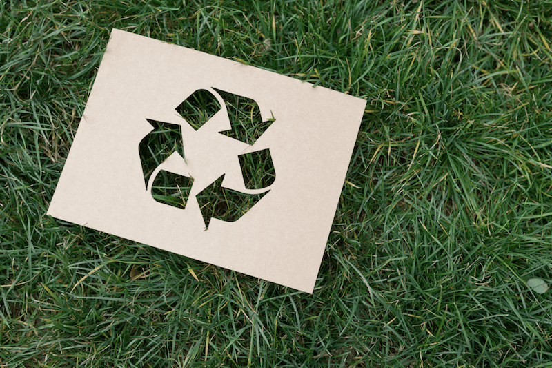 Recycling symbol on the grass